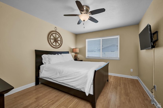 13201 Keys Blvd, Clearlake Oaks, CA 95423 - bedroom featuring wood finished floors, baseboards, and a ceiling fan