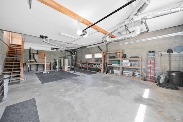 9 Spring Meadows Rd, Mccloud, CA 96507 - garage featuring concrete block wall and a garage door opener