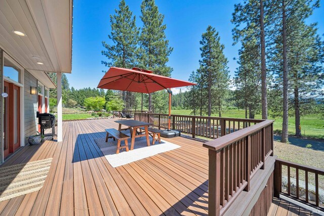 9 Spring Meadows Rd, Mccloud, CA 96507 - wooden deck with view of scattered trees and outdoor dining area