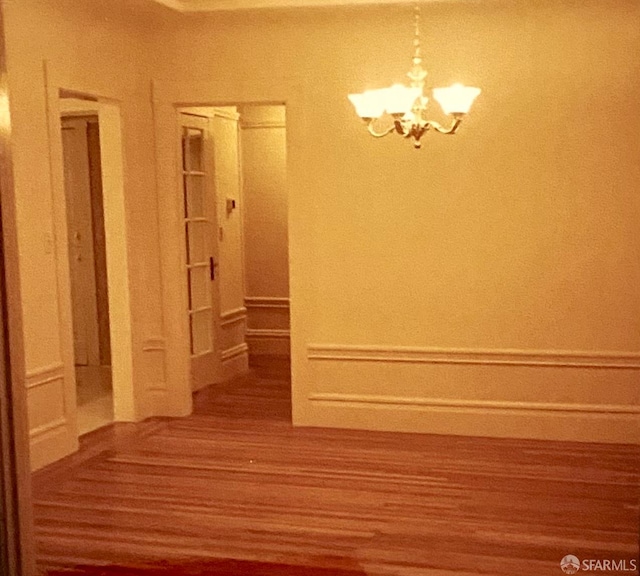 169 Forest Side Ave, San Francisco, CA 94127 - unfurnished dining area with a chandelier and wood finished floors