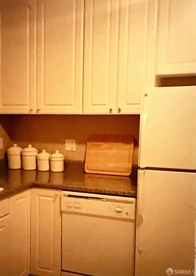 169 Forest Side Ave, San Francisco, CA 94127 - kitchen with white appliances, dark countertops, and white cabinetry