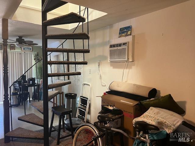 13238 Ebbtide Vlg, Clearlake Oaks, CA 95423 - staircase with a wall mounted AC and a ceiling fan