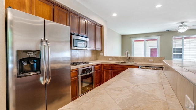 9149 Windsor Rd, Windsor, CA 95492 - kitchen featuring stainless steel appliances, tile countertops, backsplash, recessed lighting, and ceiling fan