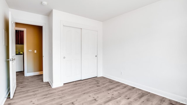 9149 Windsor Rd, Windsor, CA 95492 - unfurnished bedroom featuring light wood-style flooring and a closet