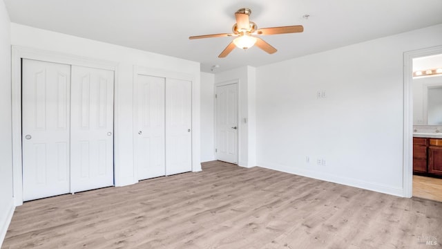 9149 Windsor Rd, Windsor, CA 95492 - unfurnished bedroom with two closets, light wood-style flooring, connected bathroom, and ceiling fan