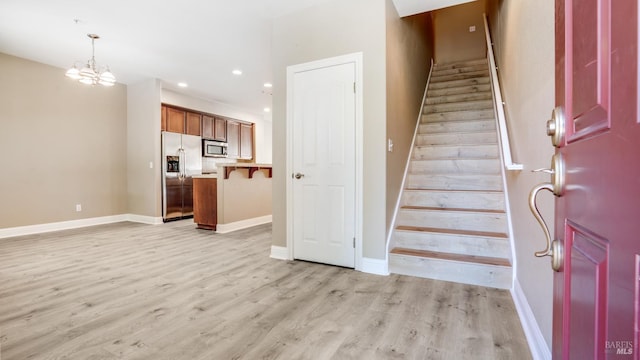 9149 Windsor Rd, Windsor, CA 95492 - stairs featuring wood finished floors, recessed lighting, and a chandelier