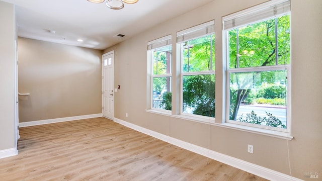 9149 Windsor Rd, Windsor, CA 95492 - spare room featuring plenty of natural light, wood finished floors, and a chandelier