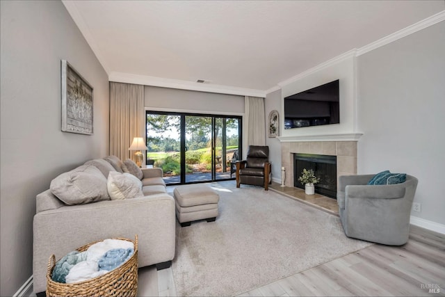 848 Acorn Way, Napa, CA 94558 - living area featuring ornamental molding, a tiled fireplace, wood finished floors, and baseboards