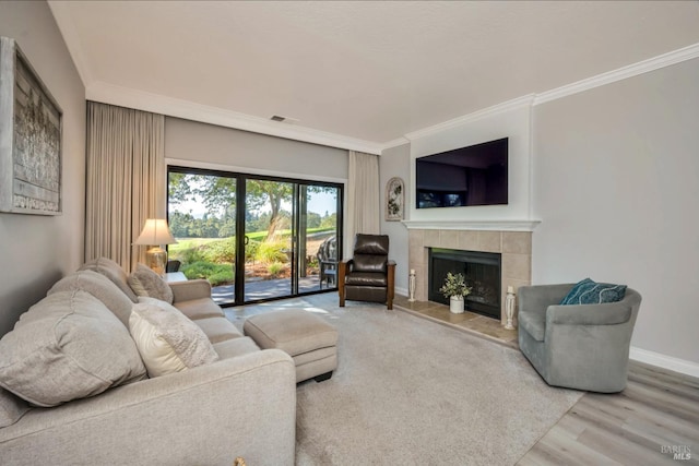 848 Acorn Way, Napa, CA 94558 - living area featuring ornamental molding, a tiled fireplace, wood finished floors, and baseboards