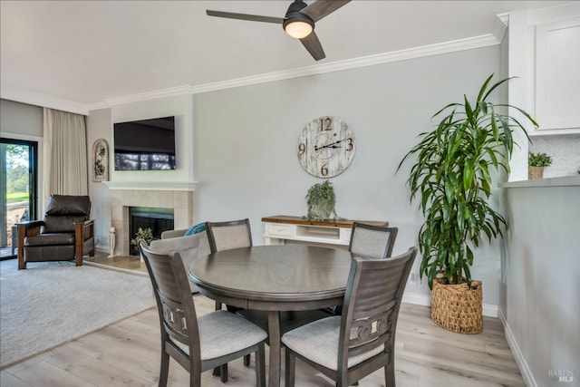 848 Acorn Way, Napa, CA 94558 - dining area featuring a fireplace, ornamental molding, a ceiling fan, light wood finished floors, and baseboards