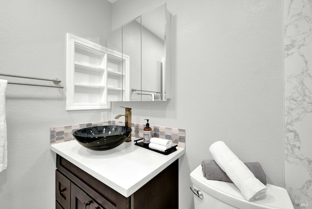 201 Pamela Ct, Vallejo, CA 94589 - bathroom featuring vanity, toilet, and decorative backsplash