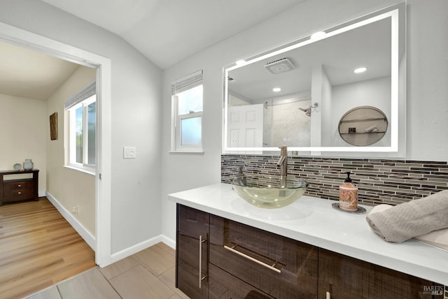 201 Pamela Ct, Vallejo, CA 94589 - full bath with vanity, backsplash, a shower stall, lofted ceiling, and baseboards