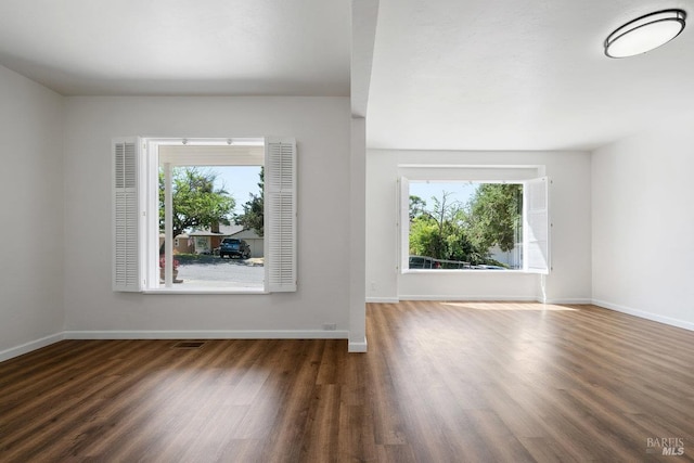 1408 Carl Ave, Vallejo, CA 94590 - unfurnished living room with healthy amount of natural light, wood finished floors, and baseboards