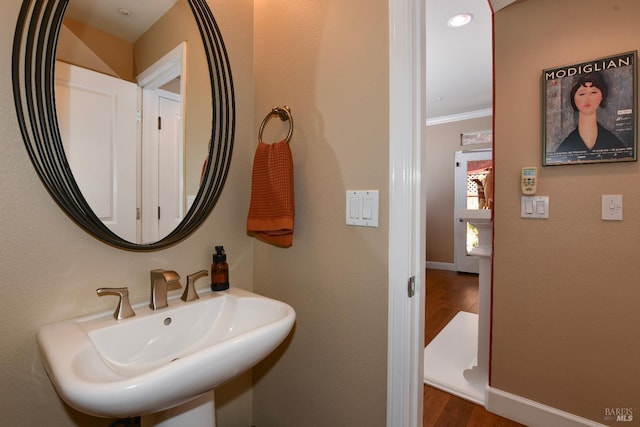 1617 Pear Tree Ln, Napa, CA 94558 - bathroom featuring wood finished floors, crown molding, a sink, and baseboards