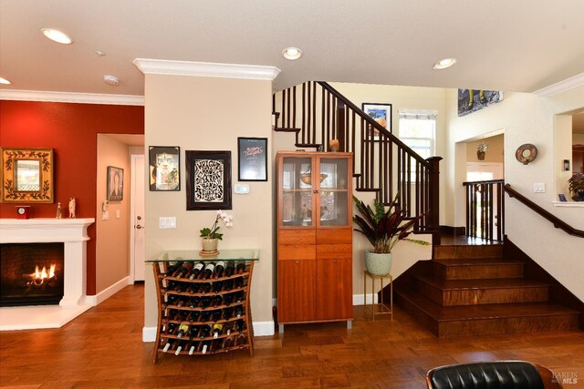 1617 Pear Tree Ln, Napa, CA 94558 - stairway with wood finished floors, ornamental molding, recessed lighting, a lit fireplace, and baseboards