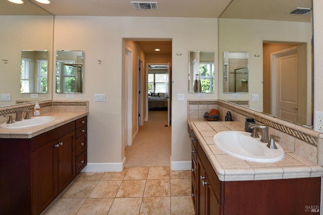 1617 Pear Tree Ln, Napa, CA 94558 - ensuite bathroom featuring two vanities, baseboards, and a shower