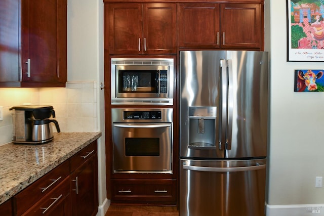 1617 Pear Tree Ln, Napa, CA 94558 - kitchen with stainless steel appliances, backsplash, light stone countertops, dark wood-style flooring, and baseboards