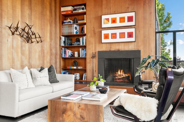 11 Crest Rd, Belvedere, CA 94920 - living room featuring wood walls and a lit fireplace
