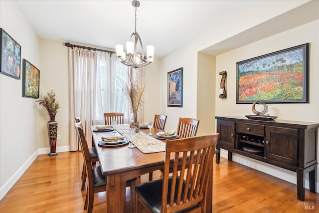 428 Lloyd Ct, Benicia, CA 94510 - dining room featuring a chandelier, light wood finished floors, and baseboards