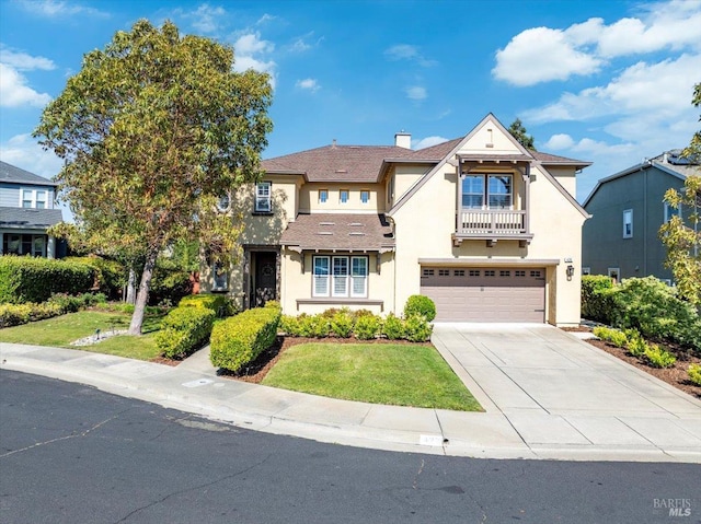 428 Lloyd Ct, Benicia, CA 94510 - view of front of home featuring a balcony, stucco siding, a garage, driveway, and a front yard