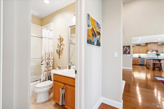 428 Lloyd Ct, Benicia, CA 94510 - bathroom with vanity, toilet, shower / tub combo with curtain, backsplash, and recessed lighting