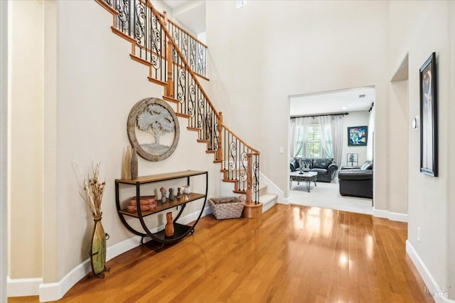 428 Lloyd Ct, Benicia, CA 94510 - entrance foyer featuring wood finished floors, stairs, baseboards, and a towering ceiling