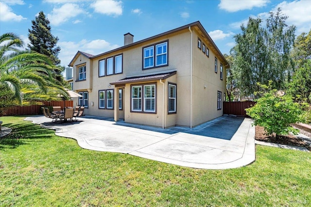 428 Lloyd Ct, Benicia, CA 94510 - back of property with stucco siding, a patio area, and a chimney