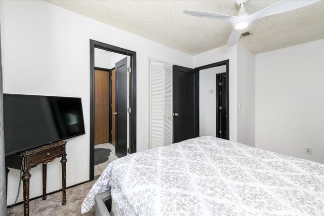 103 Quail Ct, Winters, CA 95694 - bedroom with light colored carpet, a closet, and a ceiling fan