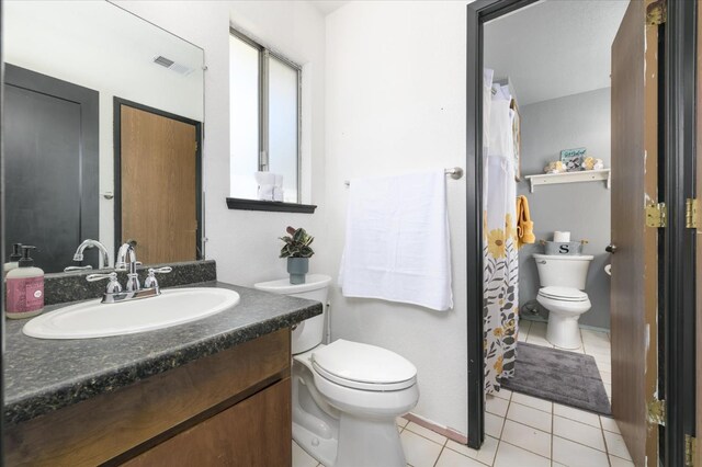 103 Quail Ct, Winters, CA 95694 - bathroom featuring vanity, tile patterned floors, and a shower with shower curtain