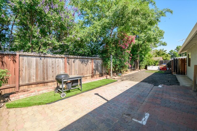 103 Quail Ct, Winters, CA 95694 - fenced backyard featuring a patio area