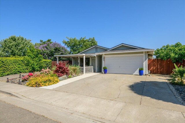 103 Quail Ct, Winters, CA 95694 - ranch-style house featuring covered porch, a garage, and concrete driveway