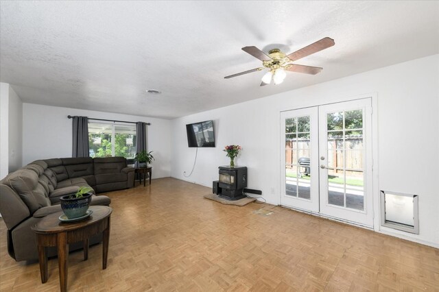 103 Quail Ct, Winters, CA 95694 - living area with a wood stove, french doors, and ceiling fan