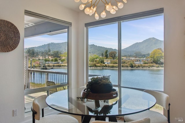 100 Lucky Dr Unit 109, Corte Madera, CA 94925 - dining room with a water and mountain view and a chandelier