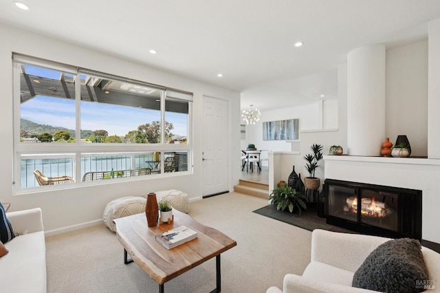 100 Lucky Dr Unit 109, Corte Madera, CA 94925 - carpeted living area with baseboards, recessed lighting, a fireplace with flush hearth, and a chandelier
