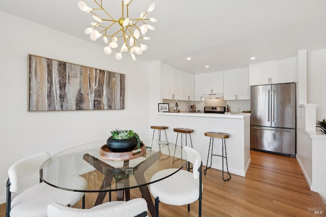 100 Lucky Dr Unit 109, Corte Madera, CA 94925 - dining area featuring light wood-type flooring, recessed lighting, a chandelier, and baseboards