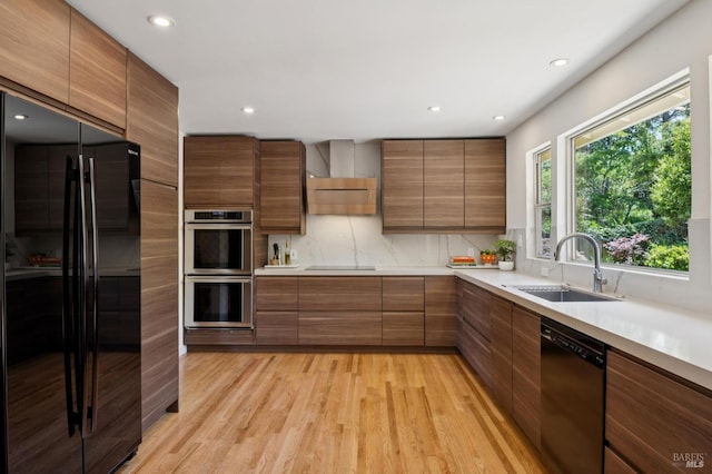 594 Tanbark Ter, San Rafael, CA 94903 - kitchen with stainless steel appliances, a sink, backsplash, light wood-type flooring, and light countertops