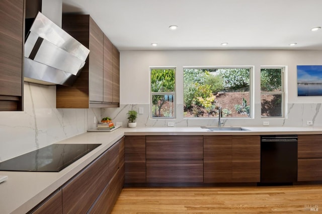 594 Tanbark Ter, San Rafael, CA 94903 - kitchen featuring black appliances, a sink, modern cabinets, exhaust hood, and light countertops