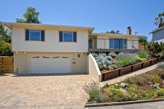 594 Tanbark Ter, San Rafael, CA 94903 - view of front facade featuring an attached garage and decorative driveway