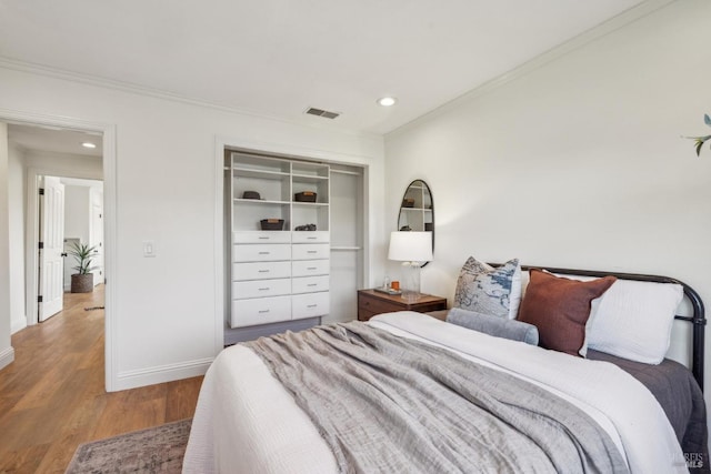 16 Tradewind Psge, Corte Madera, CA 94925 - bedroom with ornamental molding, wood finished floors, recessed lighting, baseboards, and a closet