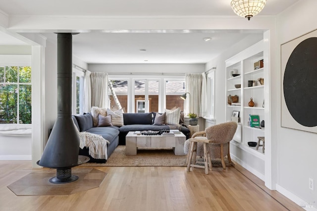 304 Laurel Way, Mill Valley, CA 94941 - living room with a wood stove, light wood finished floors, and built in features
