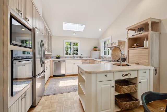 304 Laurel Way, Mill Valley, CA 94941 - kitchen with open shelves, stainless steel appliances, a skylight, light countertops, and lofted ceiling
