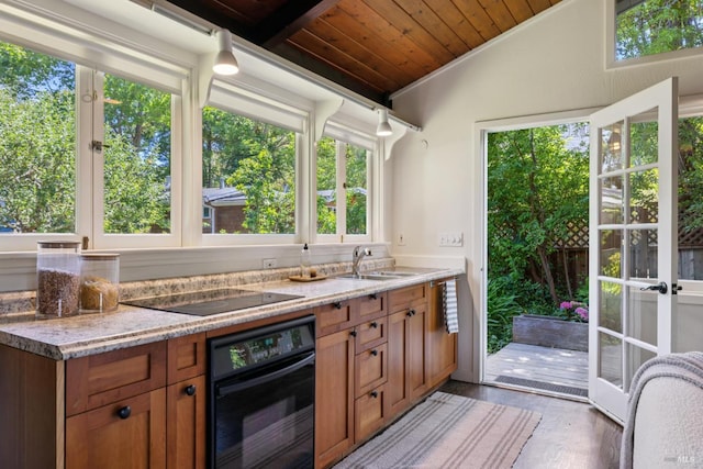 304 Laurel Way, Mill Valley, CA 94941 - kitchen featuring black appliances, wooden ceiling, brown cabinets, vaulted ceiling, and light wood finished floors