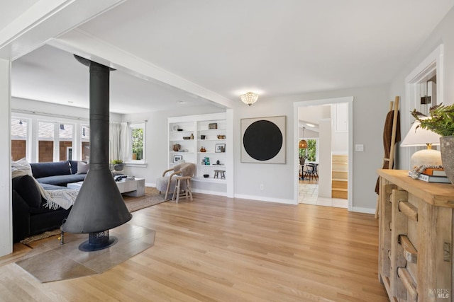 304 Laurel Way, Mill Valley, CA 94941 - entrance foyer with a wood stove, light wood-style flooring, and plenty of natural light
