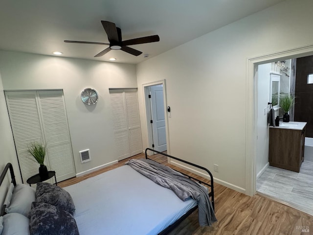 1529 San Anselmo Ave Unit A B, San Anselmo, CA 94960 - bedroom with light wood-style floors, baseboards, two closets, recessed lighting, and ceiling fan