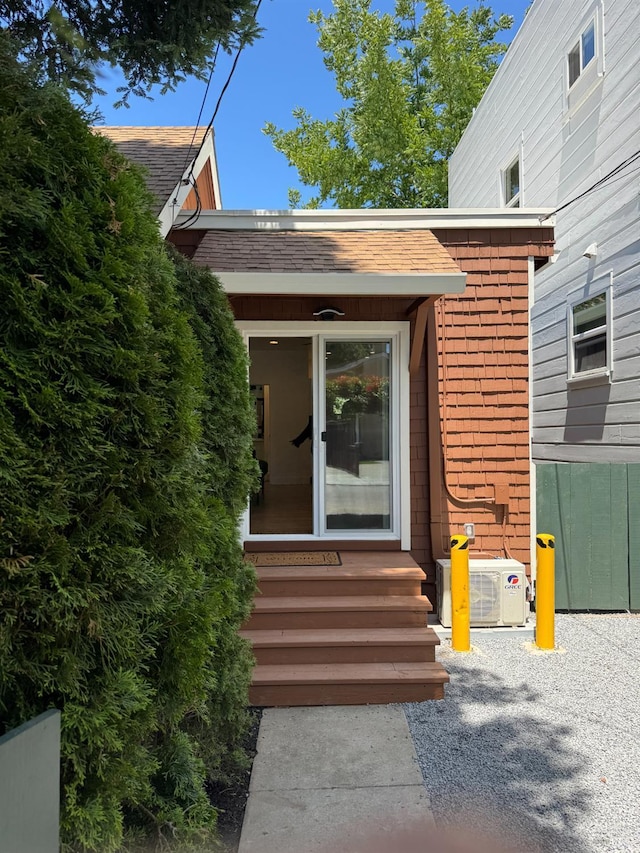 1529 San Anselmo Ave Unit A B, San Anselmo, CA 94960 - view of exterior entry featuring a cooling unit, a shingled roof, and brick siding