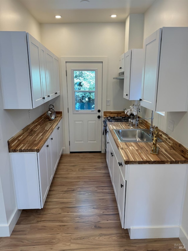 1529 San Anselmo Ave Unit A B, San Anselmo, CA 94960 - kitchen with wooden counters, recessed lighting, wood finished floors, a sink, and under cabinet range hood
