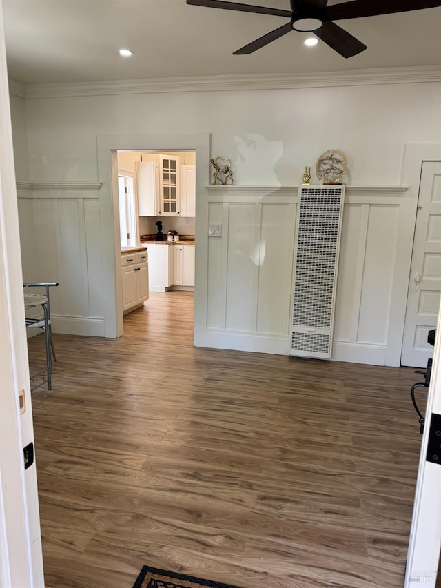 1529 San Anselmo Ave Unit A B, San Anselmo, CA 94960 - unfurnished living room featuring a heating unit, a decorative wall, ceiling fan, ornamental molding, and wood finished floors