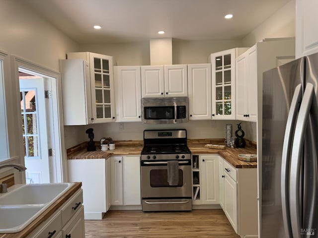 1529 San Anselmo Ave Unit A B, San Anselmo, CA 94960 - kitchen with appliances with stainless steel finishes, a sink, wooden counters, white cabinets, and recessed lighting