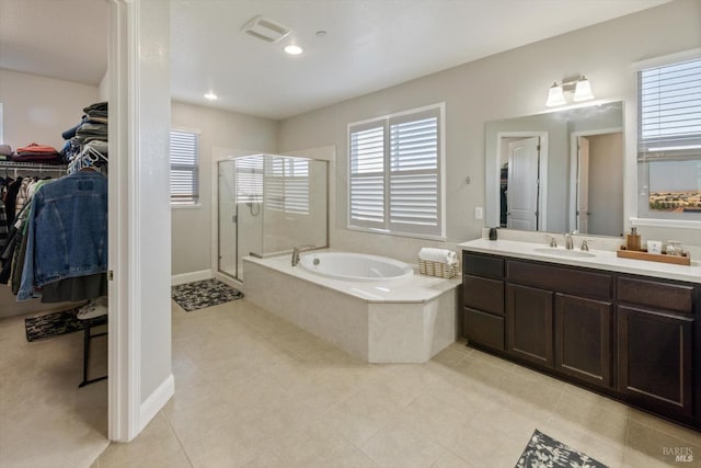 5340 Discovery Way, Fairfield, CA 94533 - bathroom featuring a shower stall, a bath, vanity, a walk in closet, and tile patterned flooring