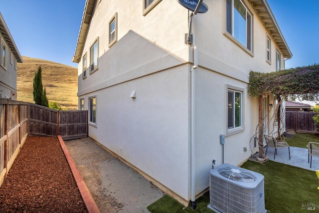 5340 Discovery Way, Fairfield, CA 94533 - view of home's exterior featuring central AC unit, stucco siding, a fenced backyard, and a patio area